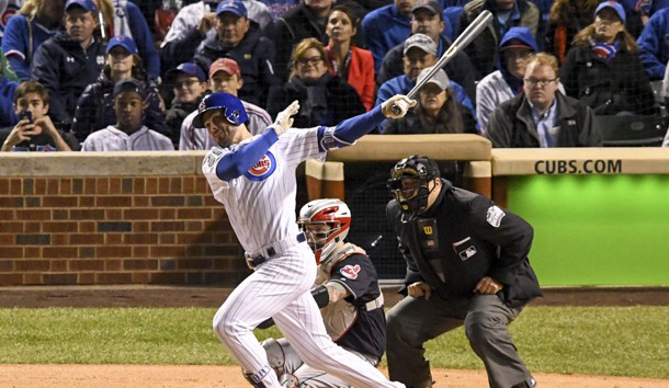 Oct 30, 2016; Chicago, IL, USA; Chicago Cubs third baseman Kris Bryant (left) hits a solo home run against Cleveland Indians catcher Roberto Perez (center) during the fourth inning in game five of the 2016 World Series at Wrigley Field. Photo Credit: Tommy Gilligan-USA TODAY Sports