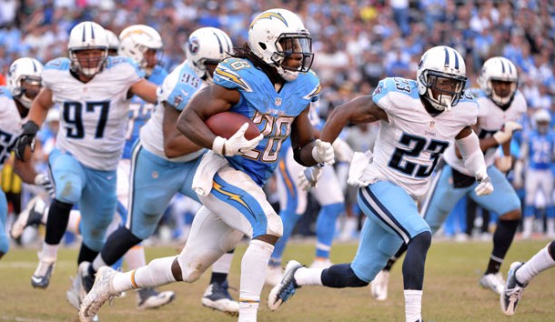 Nov 6, 2016; San Diego, CA, USA; San Diego Chargers running back Melvin Gordon (28) runs the ball as Tennessee Titans defensive back Brice McCain (23) defends during the second half at Qualcomm Stadium. San Diego won 43-35. Photo Credit: Orlando Ramirez-USA TODAY Sports