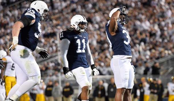 Nov 5, 2016; University Park, PA, USA; Penn State Nittany Lions defensive tackle Kevin Givens (30) reacts with teammates linebacker Brandon Bell (11) and defensive tackle Robert Windsor (54) following his sack of Iowa Hawkeyes quarterback C.J. Beathard (not pictured) during the third quarter at Beaver Stadium. Penn State defeated Iowa 41-14. Photo Credit: Rich Barnes-USA TODAY Sports
