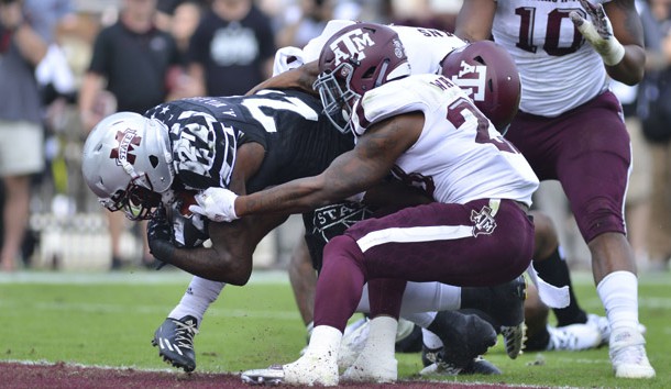 Nov 5, 2016; Starkville, MS, USA; Mississippi State Bulldogs running back Aeris Williams (27) dives into the end zone defended by Texas A&M Aggies defensive back Armani Watts (23) during the first quarter of the game at Davis Wade Stadium. Photo Credit: Matt Bush-USA TODAY Sports
