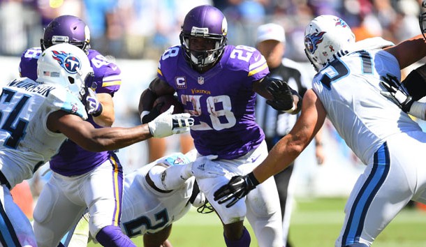 Sep 11, 2016; Nashville, TN, USA; Minnesota Vikings running back Adrian Peterson (28) runs for  a short gain against the Tennessee Titans at Nissan Stadium. The Vikings won 25-16. Photo Credit: Christopher Hanewinckel-USA TODAY Sports