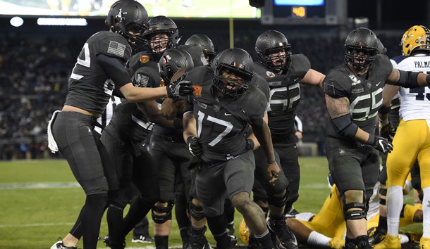 Dec 10, 2016; Baltimore, MD, USA; Army Black Knights quarterback Ahmad Bradshaw (17) celebrates with teammates after scoring a touchdown during the fourth quarter of the 117 annual Army Navy game against the Navy Midshipmen at M&T Bank Stadium. Army Black Knights defeated Navy Midshipmen 21-17. Mandatory Credit: Tommy Gilligan-USA TODAY Sports