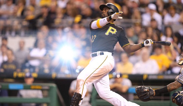 Apr 18, 2015; Pittsburgh, PA, USA; The flash from a fan's camera catches Pittsburgh Pirates center fielder Andrew McCutchen (22) in mid-swing against the Milwaukee Brewers during the third inning at PNC Park. Photo Credit: Charles LeClaire-USA TODAY Sports