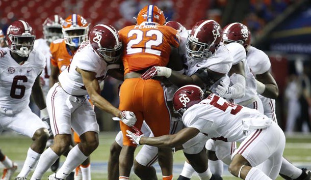 Dec 3, 2016; Atlanta, GA, USA; Florida Gators running back Lamical Perine (22) is brought down by Alabama Crimson Tide defense during the second quarter of the SEC Championship college football game at Georgia Dome. Photo Credit: Jason Getz-USA TODAY Sports