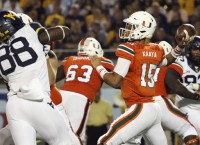 Miami blows past WVU in Russell Athletic Bowl