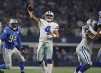 Cowboys roll, keep Lions from clinching playoff spot