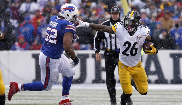 Dec 11, 2016; Orchard Park, NY, USA;  Pittsburgh Steelers running back Le'Veon Bell (26) runs the ball and tries to block Buffalo Bills inside linebacker Preston Brown (52) during the second half at New Era Field. Pittsburgh beat Buffalo 27-20. Photo Credit: Timothy T. Ludwig-USA TODAY Sports