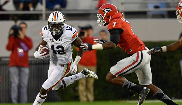 Nov 12, 2016; Athens, GA, USA; Auburn Tigers wide receiver Eli Stove (12) runs against Georgia Bulldogs linebacker Lorenzo Carter (7) during the second half at Sanford Stadium. Georgia defeated Auburn 13-7. Photo Credit: Dale Zanine-USA TODAY Sports