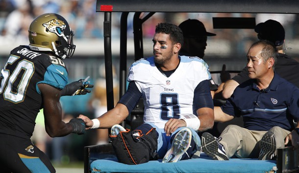 Dec 24, 2016; Jacksonville, FL, USA;  Jacksonville Jaguars outside linebacker Telvin Smith (50) speaks to Tennessee Titans quarterback Marcus Mariota (8) following a leg injury during the third quarter of an NFL Football game at EverBank Field. Photo Credit: Reinhold Matay-USA TODAY Sports