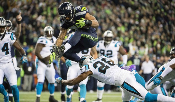 Dec 4, 2016; Seattle, WA, USA;  Seattle Seahawks running back Thomas Rawls (34) leaps over Carolina Panthers cornerback Daryl Worley (26) for a touchdown during the first quarter at CenturyLink Field. Photo Credit: Troy Wayrynen-USA TODAY Sports