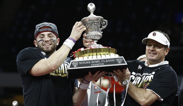 Jan 2, 2017; New Orleans , LA, USA; Oklahoma Sooners quarterback Baker Mayfield (middle) lifts the champions trophy with Sooners head coach Bob Stoops after defeating the Auburn Tigers in the 2017 Sugar Bowl at the Mercedes-Benz Superdome. Oklahoma won 35-19. Photo Credit: Derick E. Hingle-USA TODAY Sports