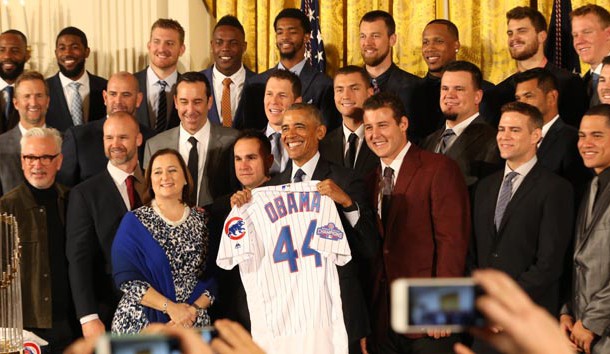 Jan 16, 2017; Washington, DC, USA; President Barack Obama holds a gift jersey while posing with members of the Chicago Cubs at a ceremony honoring the 2016 World Series Champion Cubs in the East Room at the White House. Photo Credit: Geoff Burke-USA TODAY Sports