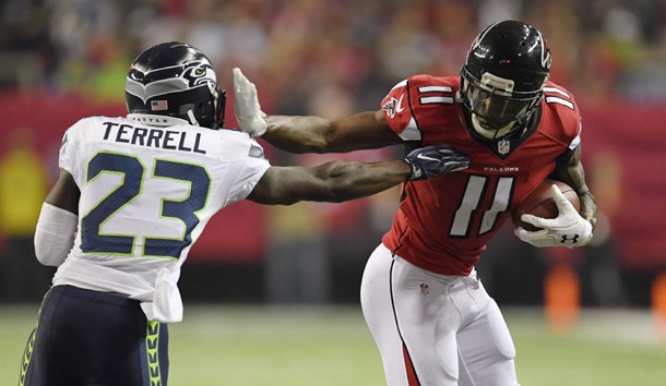 Jan 14, 2017; Atlanta, GA, USA; Atlanta Falcons wide receiver Julio Jones (11) runs after a catch against Seattle Seahawks free safety Steven Terrell (23) during the second quarter in the NFC Divisional playoff at Georgia Dome.  Photo Credit: Dale Zanine-USA TODAY Sports