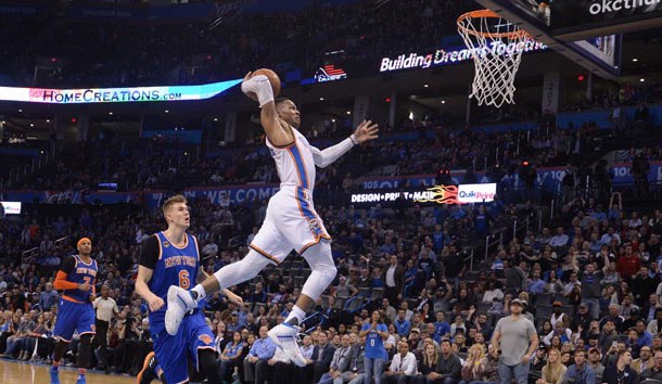 Feb 15, 2017; Oklahoma City, OK, USA; Oklahoma City Thunder guard Russell Westbrook (0) dunks the ball in front of New York Knicks forward Kristaps Porzingis (6) during the fourth quarter at Chesapeake Energy Arena. Photo Credit: Mark D. Smith-USA TODAY Sports