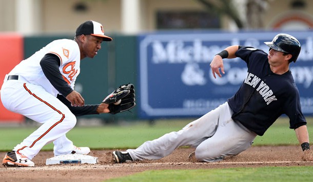 Feb 27, 2017; Sarasota, FL, USA; Baltimore Orioles infielder Jonathan Schoop (6) prepares to tag New York Yankees outfielder Dustin Fowler (77) in the second inning of the  spring training game at Ed Smith Stadium. Photo Credit: Jonathan Dyer-USA TODAY Sports
