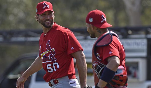 Feb 14, 2017; Jupiter, FL, USA; St. Louis Cardinals starting pitcher Adam Wainwright (left) laughs with teammate Cardinals catcher Yadier Molina (right) during Spring Training workouts at Roger Dean Stadium. Photo Credit: Steve Mitchell-USA TODAY Sports