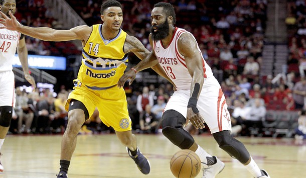 Mar 20, 2017; Houston, TX, USA; Houston Rockets guard James Harden (13) dribbles against Denver Nuggets guard Gary Harris (14) in the first quarter at Toyota Center. Photo Credit: Thomas B. Shea-USA TODAY Sports