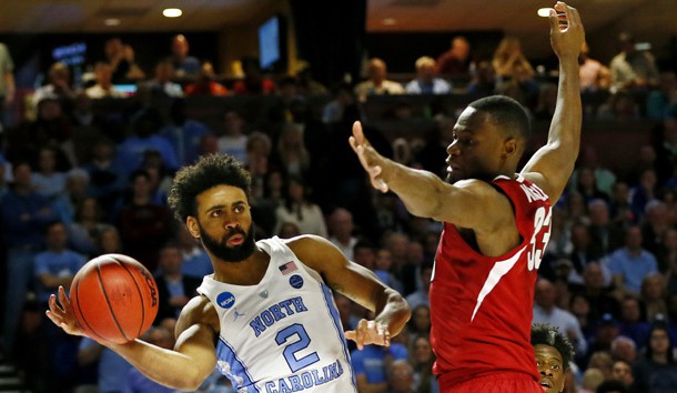 Mar 19, 2017; Greenville, SC, USA; North Carolina Tar Heels guard Joel Berry II (2) passes the ball against Arkansas Razorbacks forward Moses Kingsley (33) during the second half in the second round of the 2017 NCAA Tournament at Bon Secours Wellness Arena. Photo Credit: Jeremy Brevard-USA TODAY Sports