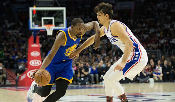 Feb 27, 2017; Philadelphia, PA, USA; Golden State Warriors forward Kevin Durant (35) dribbles past Philadelphia 76ers forward Dario Saric (9) during the first quarter at Wells Fargo Center. Photo Credit: Bill Streicher-USA TODAY Sports