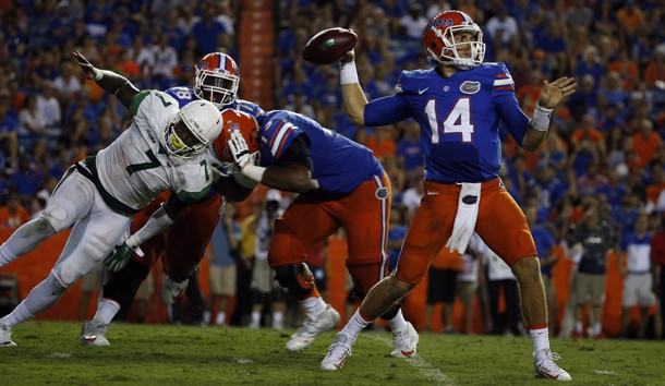 Sep 17, 2016; Gainesville, FL, USA;  Florida Gators quarterback Luke Del Rio (14) thows the ball as North Texas Mean Green defensive end Jareid Combs (7) rushes during the second half at Ben Hill Griffin Stadium. Florida Gators defeated the North Texas Mean Green 32-0. Photo Credit: Kim Klement-USA TODAY Sports