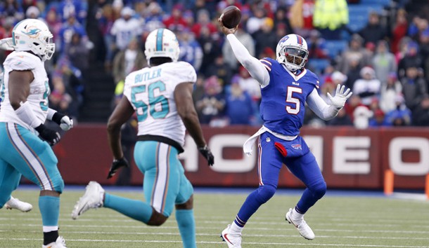 Dec 24, 2016; Orchard Park, NY, USA;  Buffalo Bills quarterback Tyrod Taylor (5) throws a pass during the second half against the Miami Dolphins at New Era Field. Miami beats Buffalo 34 to 31 in overtime. Photo Credit: Timothy T. Ludwig-USA TODAY Sports