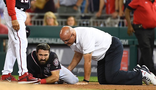 Apr 28, 2017; Washington, DC, USA; Washington Nationals center fielder Adam Eaton (2) is looked at by a trainer after suffering an apparent leg injury during the ninth inning against the New York Mets at Nationals Park. Photo Credit: Brad Mills-USA TODAY Sports
