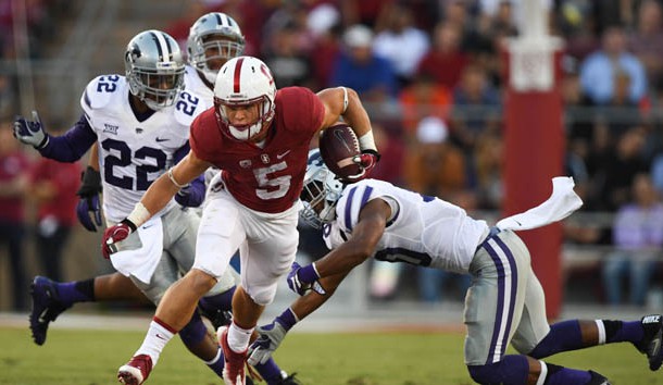 September 2, 2016; Stanford, CA, USA; Stanford Cardinal running back Christian McCaffrey (5) runs with the football past Kansas State Wildcats defensive back Dante Barnett (22) and defensive back Donnie Starks (10) during the second quarter at Stanford Stadium. Photo Credit: Kyle Terada-USA TODAY Sports