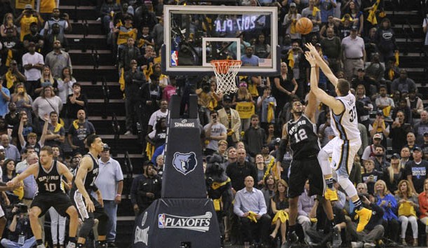 Apr 22, 2017; Memphis, TN, USA; Memphis Grizzlies center Marc Gasol (33) shoots a game winning shot over San Antonio Spurs forward LaMarcus Aldridge (12) in overtime of game four of the first round of the 2017 NBA Playoffs at FedExForum. Memphis Grizzlies defeated the San Antonio Spurs 110-108 in overtime. Photo Credit: Justin Ford-USA TODAY Sports