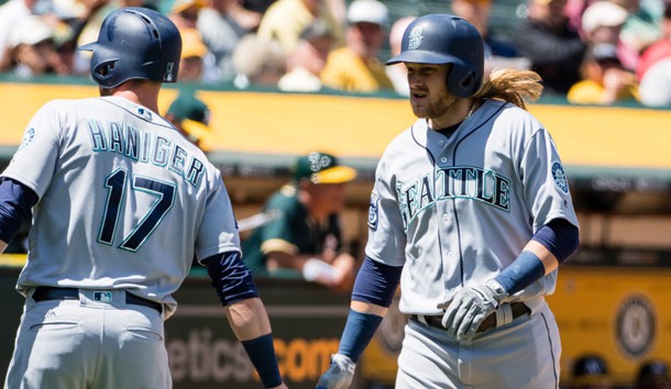 Apr 23, 2017; Oakland, CA, USA; Seattle Mariners shortstop Taylor Motter (21) high fives right fielder Mitch Haniger (17) after hitting a grand slam home run against the Oakland Athletics during the third inning at Oakland Coliseum. Photo Credit: Kelley L Cox-USA TODAY Sports