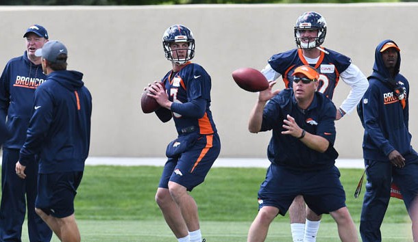 May 23, 2017; Englewood, CO, USA; Denver Broncos quarterback Trevor Siemian (13) and quarterback Paxton Lynch (12) during organized training activities at the UCHealth Training Center. Photo Credit: Ron Chenoy-USA TODAY Sports