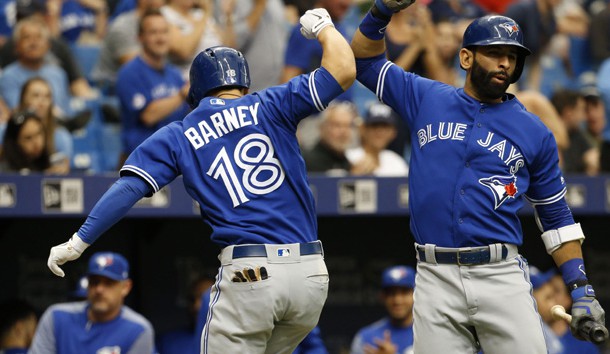 May 7, 2017; St. Petersburg, FL, USA; Toronto Blue Jays third baseman Darwin Barney (18) celebrates with Blue Jays right fielder Jose Bautista (19) after hitting a home run during the eighth inning against the Tampa Bay Rays at Tropicana Field. The Blue Jays won 2-1. Photo Credit: Kim Klement-USA TODAY Sports