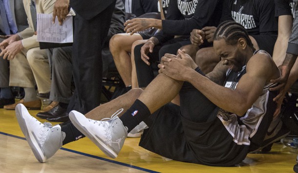 May 14, 2017; Oakland, CA, USA; San Antonio Spurs forward Kawhi Leonard (2) reacts after an injury during the third quarter in game one of the Western conference finals of the 2017 NBA Playoffs against the Golden State Warriors at Oracle Arena. The Warriors defeated the Spurs 113-111. Photo Credit: Kyle Terada-USA TODAY Sports