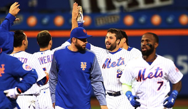 May 8, 2017; New York City, NY, USA; New York Mets second baseman Neil Walker (20) is congratulated by his teammates after hitting a game winning walkoff single against the San Francisco Giants during the ninth inning at Citi Field. Photo Credit: Andy Marlin-USA TODAY Sports