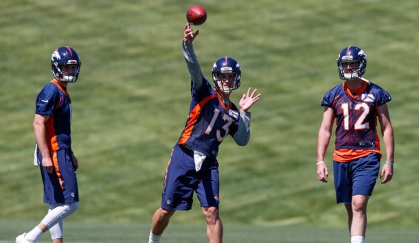 Jun 13, 2017; Englewood, CO, USA; Denver Broncos quarterback Kyle Sloter (1) and quarterback Paxton Lynch (12) watch as quarterback Trevor Siemian (13) throws a pass during minicamp at UCHealth Training Center. Photo Credit: Isaiah J. Downing-USA TODAY Sports