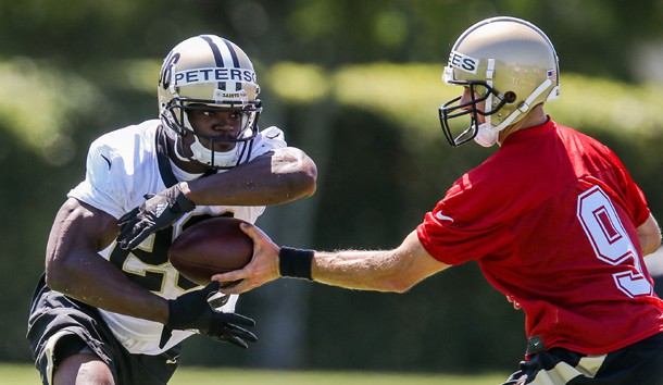 May 25, 2017; New Orleans, LA, USA; New Orleans Saints quarterback Drew Brees (9) hands the ball off to running back Adrian Peterson (28) during organized team activities at the New Orleans Saints training facility. Photo Credit: Stephen Lew-USA TODAY Sports