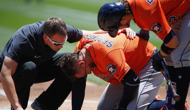 Jun 22, 2017; Oakland, CA, USA; Houston Astros center fielder George Springer (4) lays on the field after getting hit by a pitch from Oakland Athletics starting pitcher Jesse Hahn (not pictured) as he is checked by medical staff during the first inning at Oakland Coliseum. Photo Credit: Stan Szeto-USA TODAY Sports