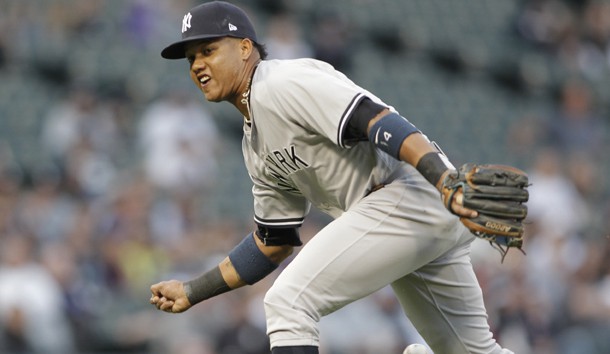 Jun 26, 2017; Chicago, IL, USA; New York Yankees second baseman Starlin Castro (14) miss judges a ground ball during the first inning against the Chicago White Sox at Guaranteed Rate Field. Photo Credit: Caylor Arnold-USA TODAY Sports