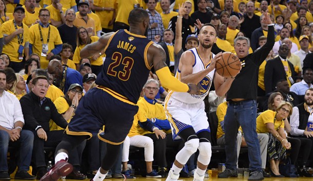 Jun 1, 2017; Oakland, CA, USA; Golden State Warriors guard Stephen Curry (30) shoots against Cleveland Cavaliers forward LeBron James (23) in the second half of the 2017 NBA Finals at Oracle Arena. Photo Credit: Kyle Terada-USA TODAY Sports