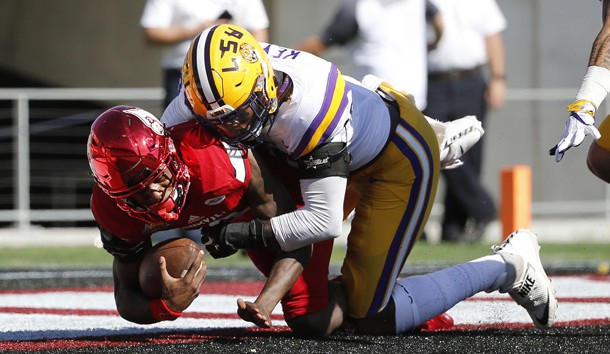 Dec 31, 2016; Orlando, FL, USA; Louisville Cardinals quarterback Lamar Jackson (8) is sacked for a safety by LSU Tigers defensive end Arden Key (49) during the first half at Camping World Stadium. Photo Credit: Kim Klement-USA TODAY Sports