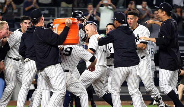 Jul 27, 2017; Bronx, NY, USA; New York Yankees left fielder Brett Gardner (11) is congratulated after hitting a walk off game winning home run against the Tampa Bay Rays during the eleventh inning at Yankee Stadium. Photo Credit: Andy Marlin-USA TODAY Sports
