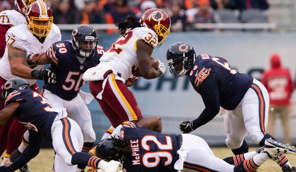 Dec 24, 2016; Chicago, IL, USA; Washington Redskins running back Rob Kelley (32) and Chicago Bears inside linebacker Jerrell Freeman (50) and outside linebacker Pernell McPhee (92) and defensive end C.J. Wilson (69) during the game at Soldier Field. The Redskins defeat the Bears 41-21. Photo Credit: Jerome Miron-USA TODAY Sports