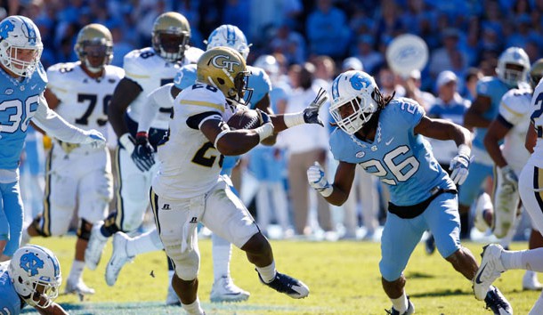 Nov 5, 2016; Chapel Hill, NC, USA;  Georgia Tech Yellow Jackets running back Dedrick Mills (26) runs with the ball against North Carolina Tar Heels defensive back Dominquie Green (26) at Kenan Memorial Stadium. The North Carolina Tar Heels defeated the Georgia Tech Yellow Jackets 48-20. Photo Credit: James Guillory-USA TODAY Sports