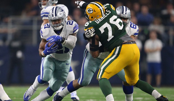 Jan 15, 2017; Arlington, TX, USA; Dallas Cowboys running back Ezekiel Elliott (21) runs with the ball behind the block of guard Ronald Leary (65) against Green Bay Packers defensive tackle Mike Daniels (76) in the NFC Divisional playoff game at AT&T Stadium. Photo Credit: Matthew Emmons-USA TODAY Sports