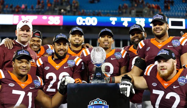 Dec 29, 2016; Charlotte, NC, USA; The Virginia Tech Hokies seniors pose for a picture with the trophy after defeating the Arkansas Razorbacks in the Belk Bowl at Bank of America Stadium. Virginia Tech defeated Arkansas 35-24. Photo Credit: Jeremy Brevard-USA TODAY Sports