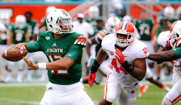 Oct 24, 2015; Miami Gardens, FL, USA; Miami Hurricanes quarterback Malik Rosier (12) throws a pass as Clemson Tigers linebacker B.J. Goodson (44) applies pressure during the first half at Sun Life Stadium. Photo Credit: Steve Mitchell-USA TODAY Sports