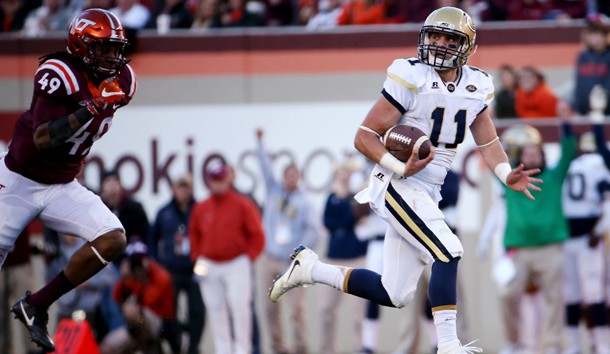 Nov 12, 2016; Blacksburg, VA, USA;  Georgia Tech Yellow Jackets quarterback Matthew Jordan (11) runs for a touchdown during the second quarter against Virginia Tech Hokies linebacker Tremaine Edmunds (49) during the second quarter at Lane Stadium. Photo Credit: Peter Casey-USA TODAY Sports