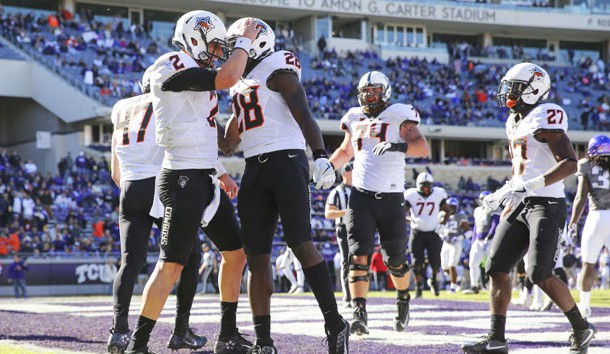 Nov 19, 2016; Fort Worth, TX, USA; Oklahoma State Cowboys quarterback Mason Rudolph (2) celebrates with  wide receiver James Washington (28) after running for a touchdown during the second half against the TCU Horned Frogs at Amon G. Carter Stadium. Photo Credit: Kevin Jairaj-USA TODAY Sports