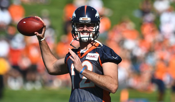 Jul 27, 2017; Englewood, CO, USA; Denver Broncos quarterback Paxton Lynch (12) warms up during training camp at the UCHealth Training Center. Photo Credit: Ron Chenoy-USA TODAY Sports