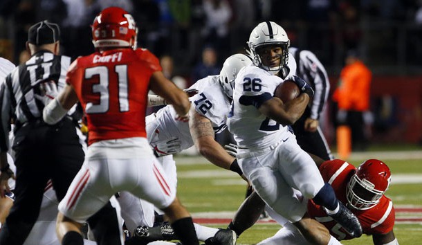 Nov 19, 2016; Piscataway, NJ, USA; Penn State Nittany Lions running back Saquon Barkley (26) rushes against Rutgers Scarlet Knights defensive back Anthony Cioffi (31) during first half at High Points Solutions Stadium. Mandatory Credit: Noah K. Murray-USA TODAY Sports