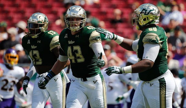 Oct 8, 2016; Tampa, FL, USA; South Florida Bulls linebacker Auggie Sanchez (43) is congratulated after he made a stop against the East Carolina Pirates during the first quarter at Raymond James Stadium. Photo Credit: Kim Klement-USA TODAY Sports
